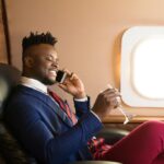 handsome-african-young-man-suit-private-jet-cabin_219728-423-transformed